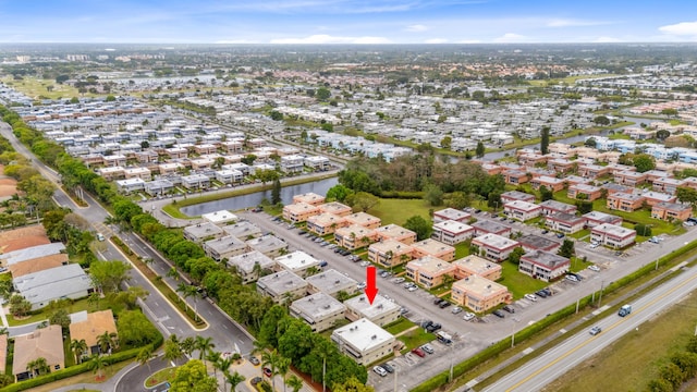 bird's eye view featuring a residential view and a water view