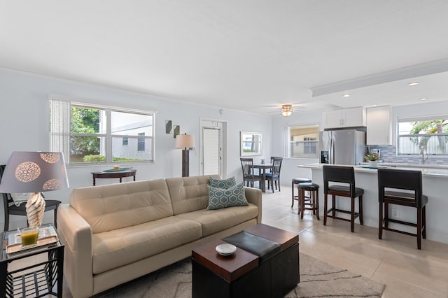 living area with light tile patterned flooring, recessed lighting, and ceiling fan