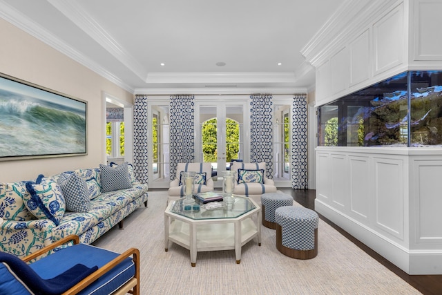 living area with crown molding, wood finished floors, french doors, and recessed lighting