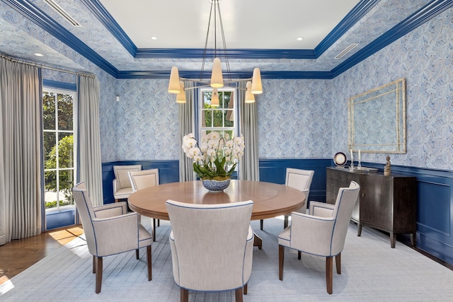 dining space with plenty of natural light, wainscoting, and wallpapered walls