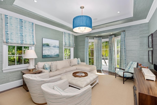 living room featuring recessed lighting, baseboards, crown molding, and a tray ceiling