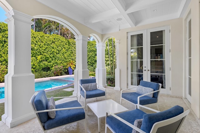 view of patio with french doors and a pool with connected hot tub