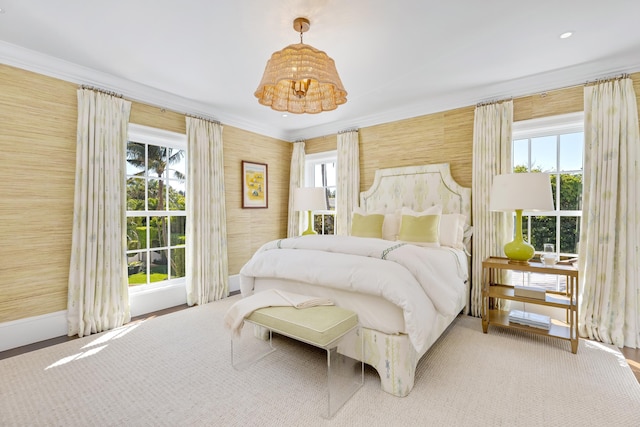 bedroom with multiple windows, wallpapered walls, and crown molding