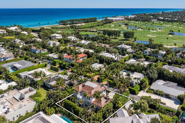 birds eye view of property with a residential view, a water view, and view of golf course