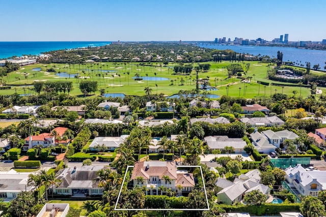 aerial view with a water view and view of golf course