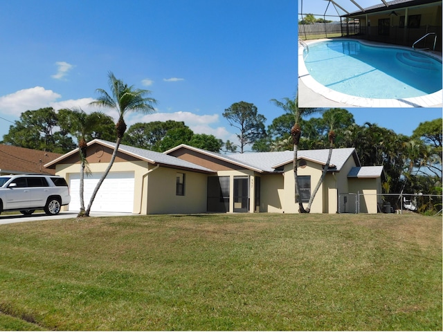 exterior space with a front lawn, fence, a garage, and stucco siding