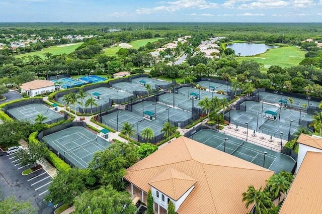 aerial view featuring a water view and golf course view