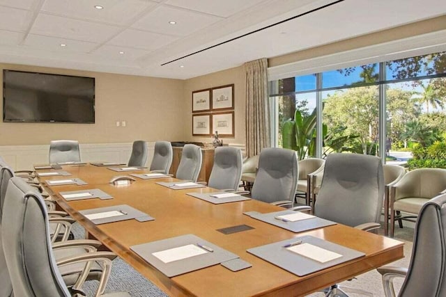 office space featuring recessed lighting, a wainscoted wall, wood finished floors, and a decorative wall