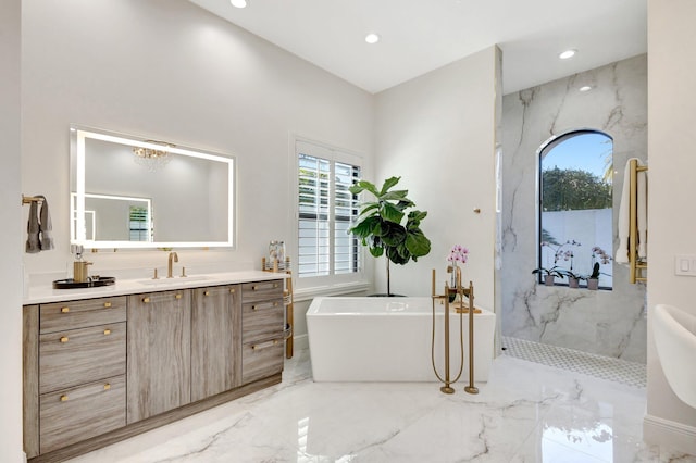 full bathroom featuring marble finish floor, recessed lighting, a marble finish shower, a freestanding bath, and vanity