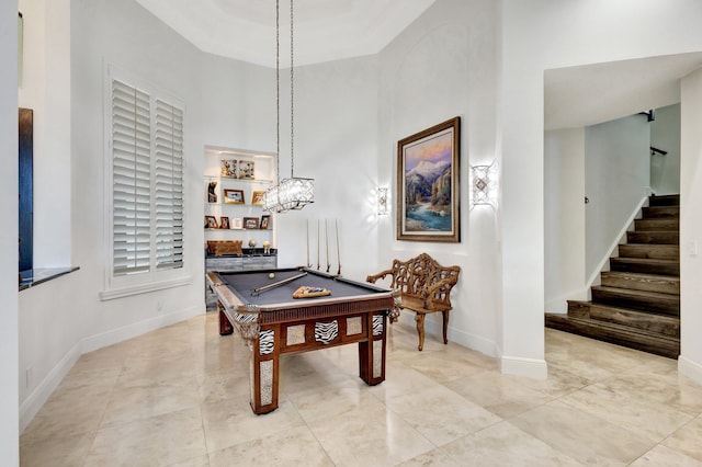 rec room with billiards, baseboards, and a towering ceiling