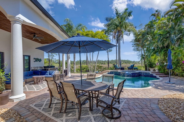 view of swimming pool featuring outdoor dining space, a ceiling fan, a pool with connected hot tub, outdoor lounge area, and a patio area