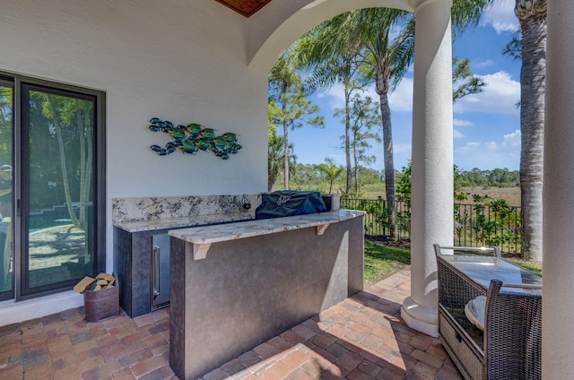 view of patio featuring fence