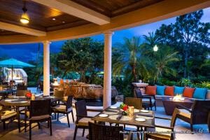 view of patio featuring outdoor dining space and an outdoor living space with a fire pit