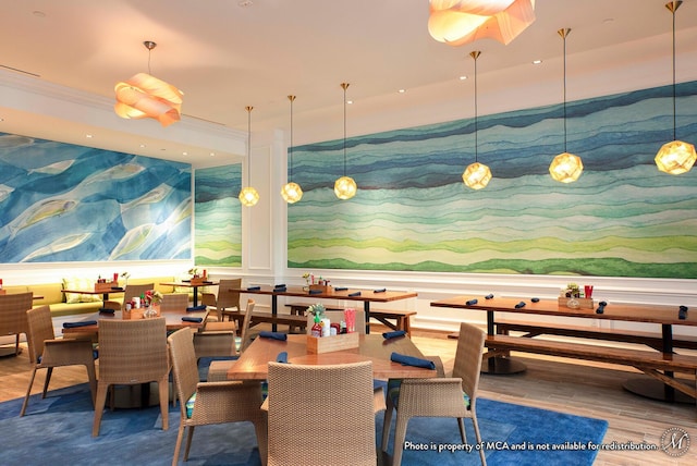 dining space featuring recessed lighting, wood finished floors, and crown molding