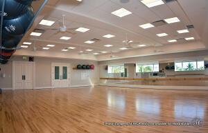 exercise room featuring wood finished floors