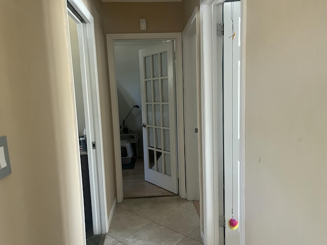 corridor featuring light tile patterned floors