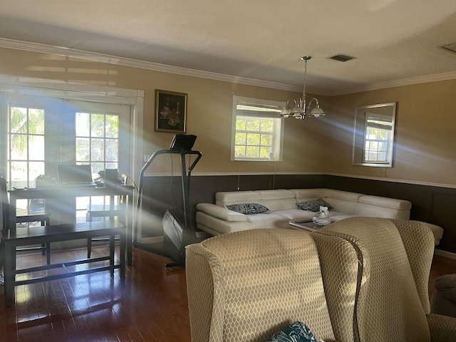 dining area featuring plenty of natural light, visible vents, wood-type flooring, and wainscoting