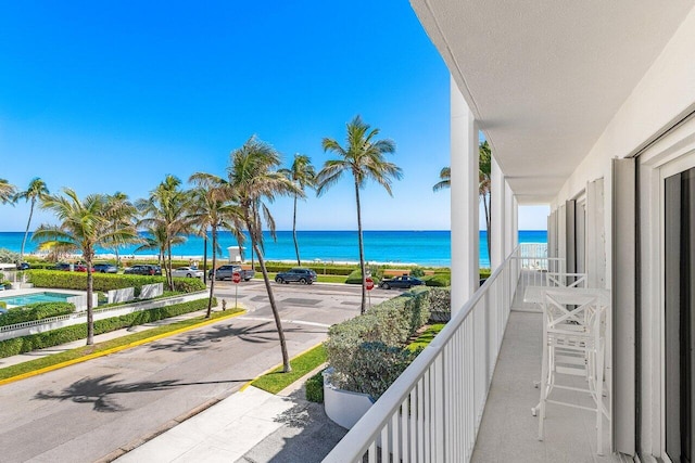 balcony featuring a water view