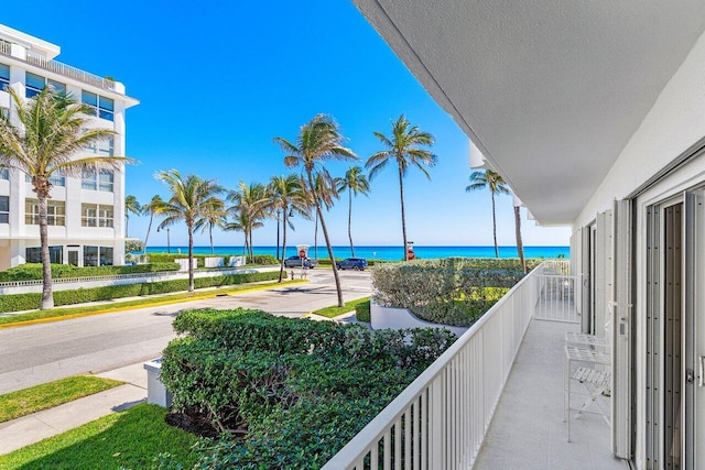 balcony featuring a water view