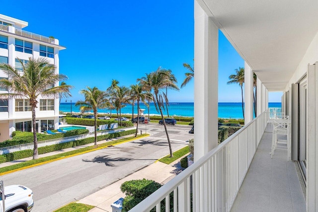 balcony featuring a water view