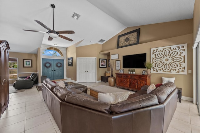 living room with light tile patterned floors, visible vents, ceiling fan, and vaulted ceiling