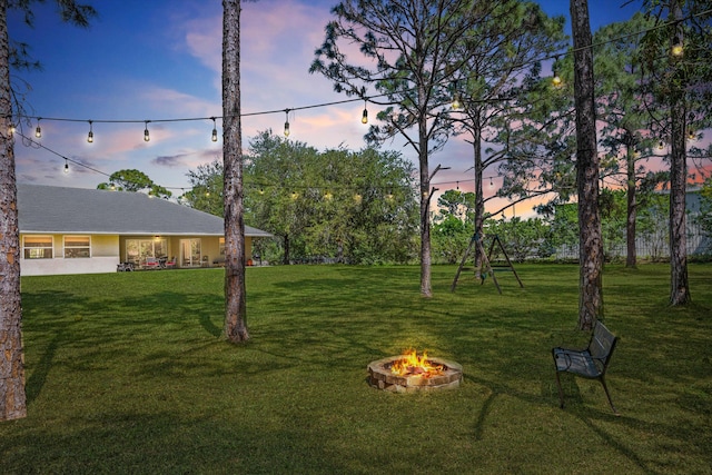 view of yard featuring a fire pit