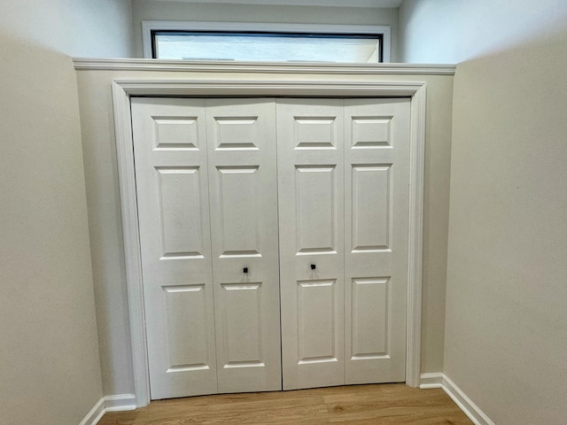 details featuring wood finished floors and baseboards