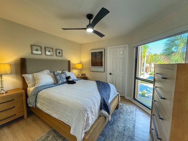 bedroom featuring light wood-style flooring and a ceiling fan