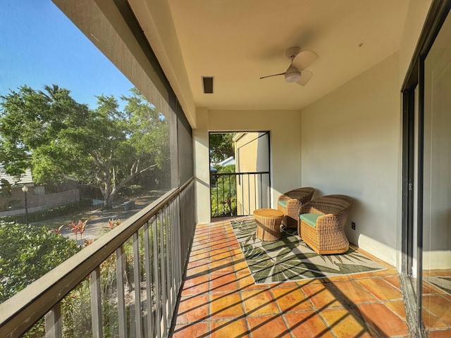 balcony with visible vents and ceiling fan