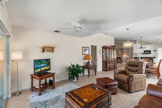 living room with visible vents, baseboards, ceiling fan, and light tile patterned flooring