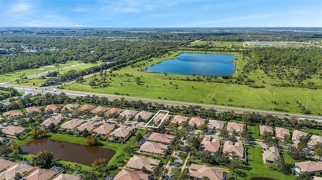 birds eye view of property featuring a water view and a residential view