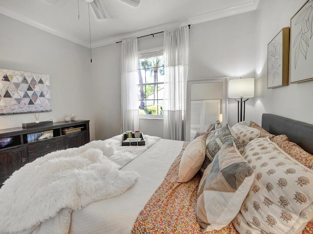 bedroom with ornamental molding and a ceiling fan