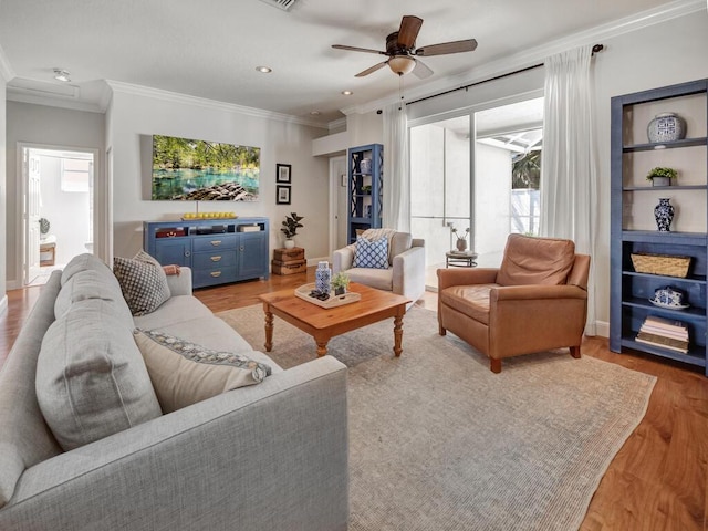 living room featuring recessed lighting, light wood-style floors, ceiling fan, and ornamental molding