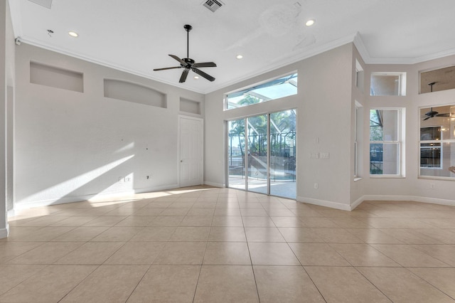 empty room with visible vents, a ceiling fan, crown molding, tile patterned flooring, and baseboards