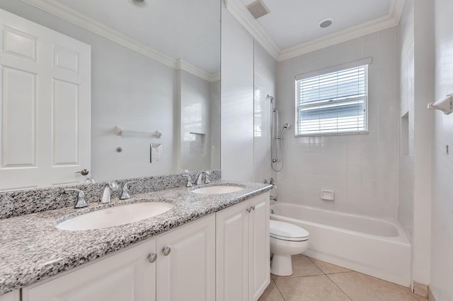 bathroom featuring a sink, visible vents, toilet, and tile patterned floors