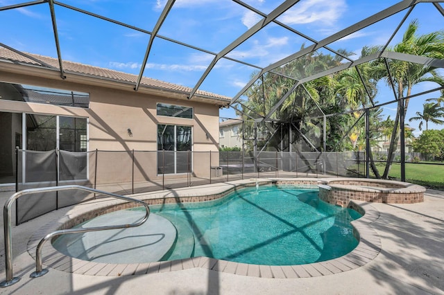 view of swimming pool with glass enclosure, a patio, and a pool with connected hot tub