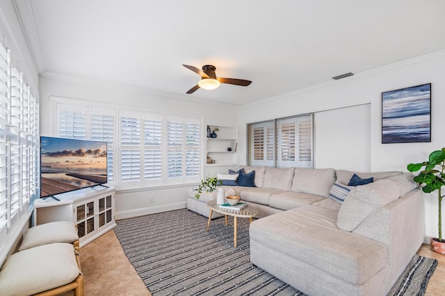 tiled living room featuring visible vents, built in shelves, crown molding, baseboards, and ceiling fan