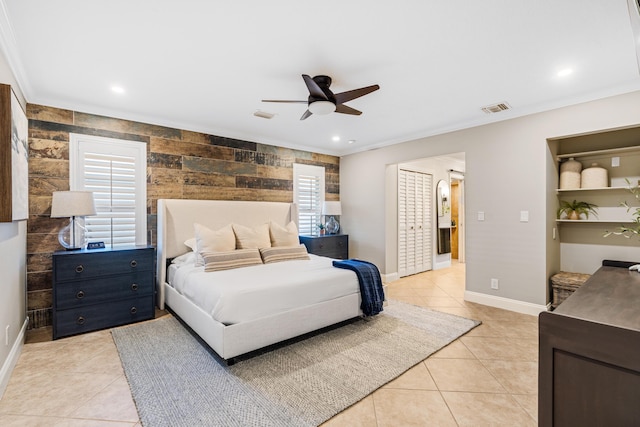 bedroom with visible vents, crown molding, baseboards, light tile patterned floors, and multiple windows