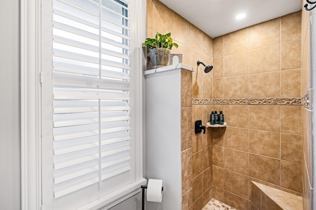 full bathroom with a tile shower