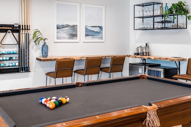 rec room featuring a bar and billiards