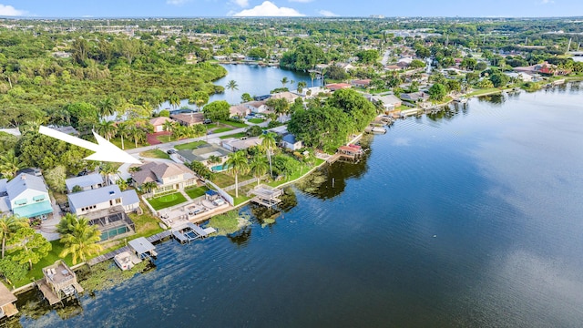 bird's eye view featuring a residential view and a water view