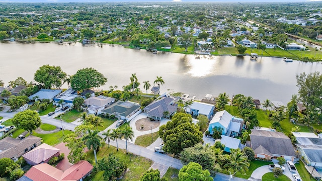 bird's eye view with a residential view and a water view