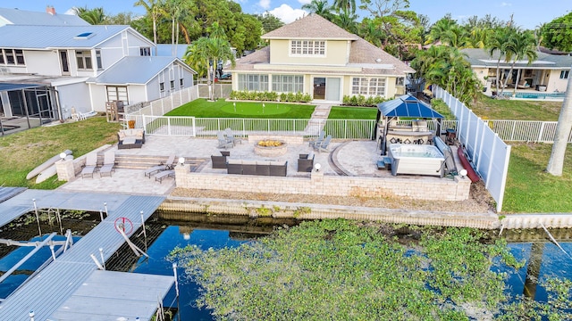 dock area featuring a yard, a patio, and a fenced backyard