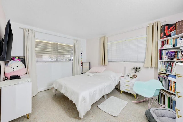 bedroom featuring baseboards