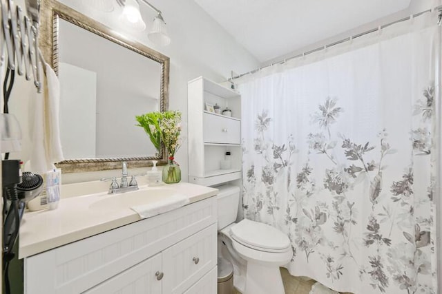 bathroom featuring curtained shower, toilet, and vanity