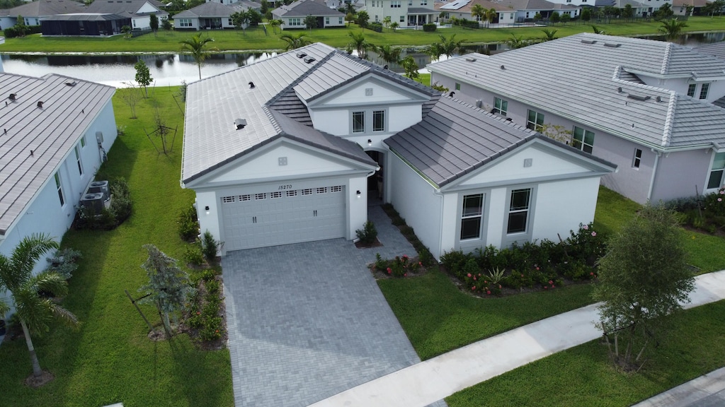 birds eye view of property featuring a residential view and a water view