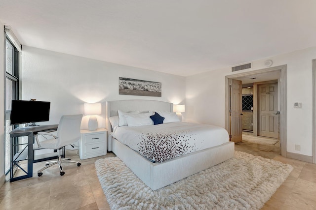 bedroom featuring visible vents and baseboards