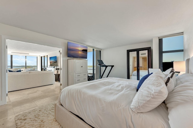 bedroom featuring expansive windows