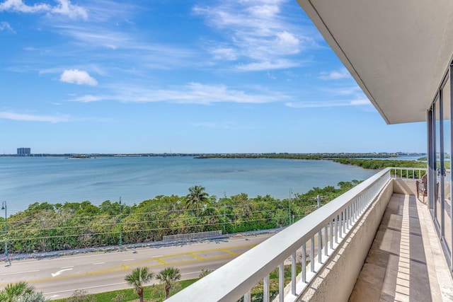 balcony featuring a water view