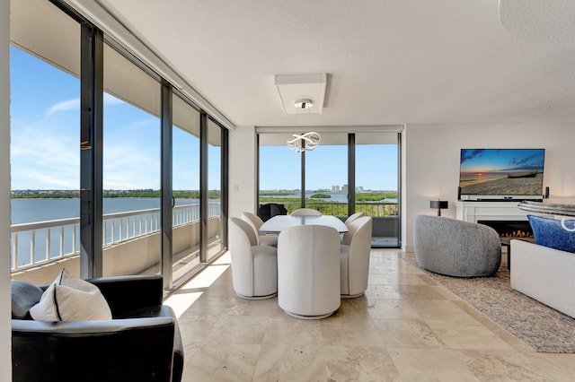 interior space featuring a water view and an inviting chandelier